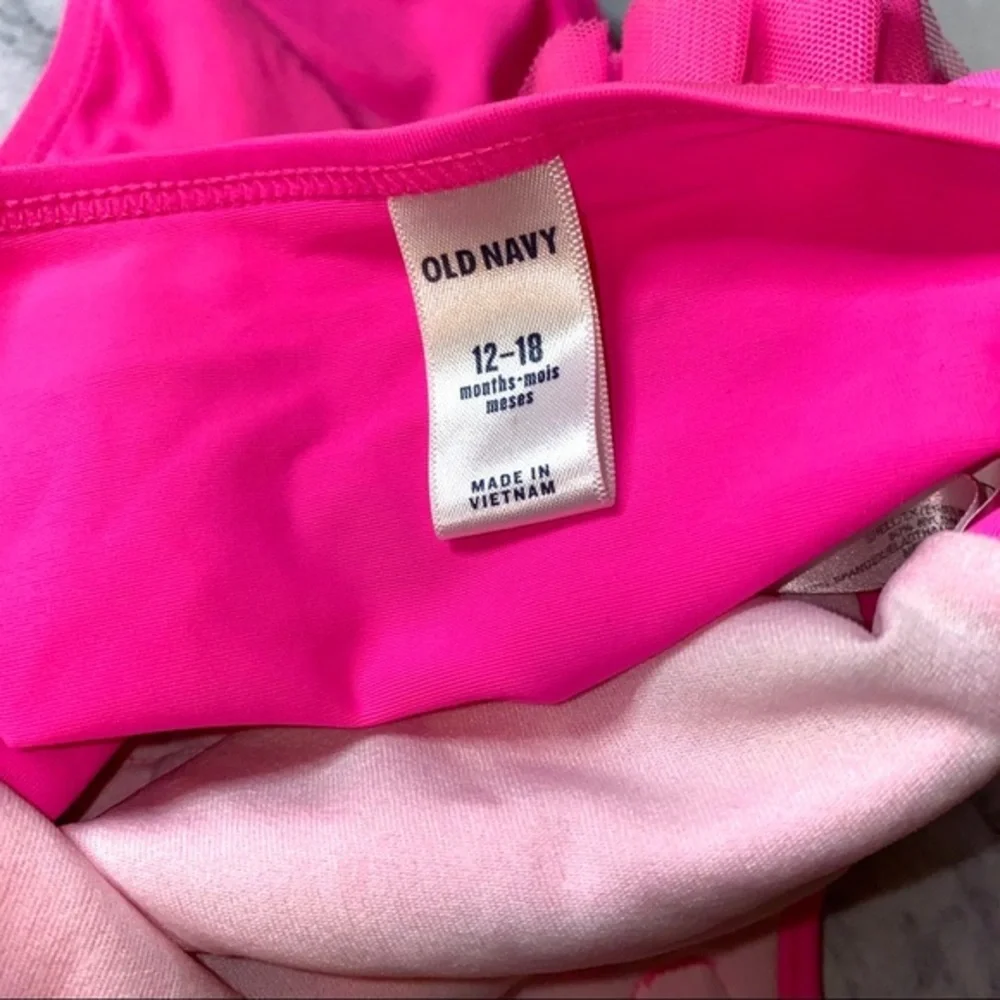 Old navy pink swim suit like new w flower 12-18